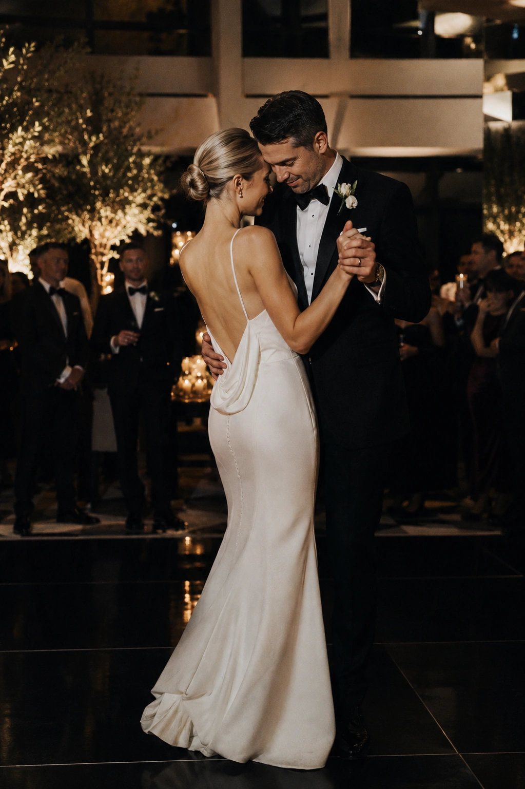 Wedding guests celebrating together on an energetic luxury dance floor
